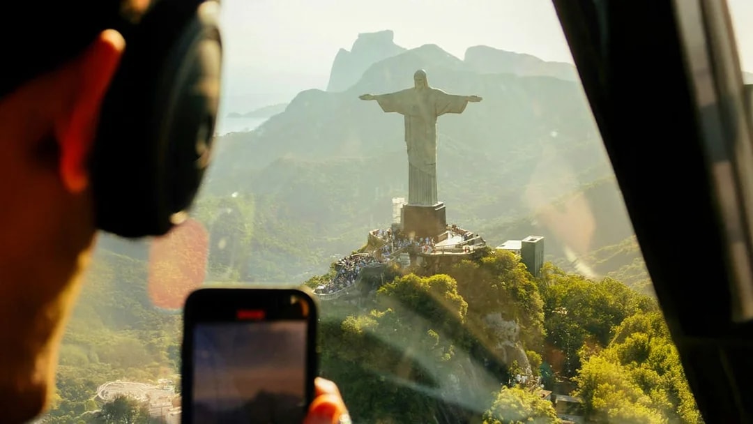 Helicopter view of Christ the Redeemer statue in Rio de Janeiro.