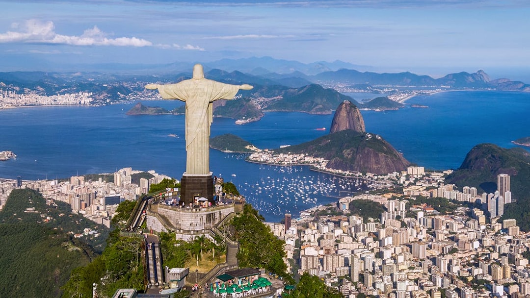 Aerial view of Christ the Redeemer, Sugarloaf Mountain, and Rio de Janeiro cityscape, Brazil.