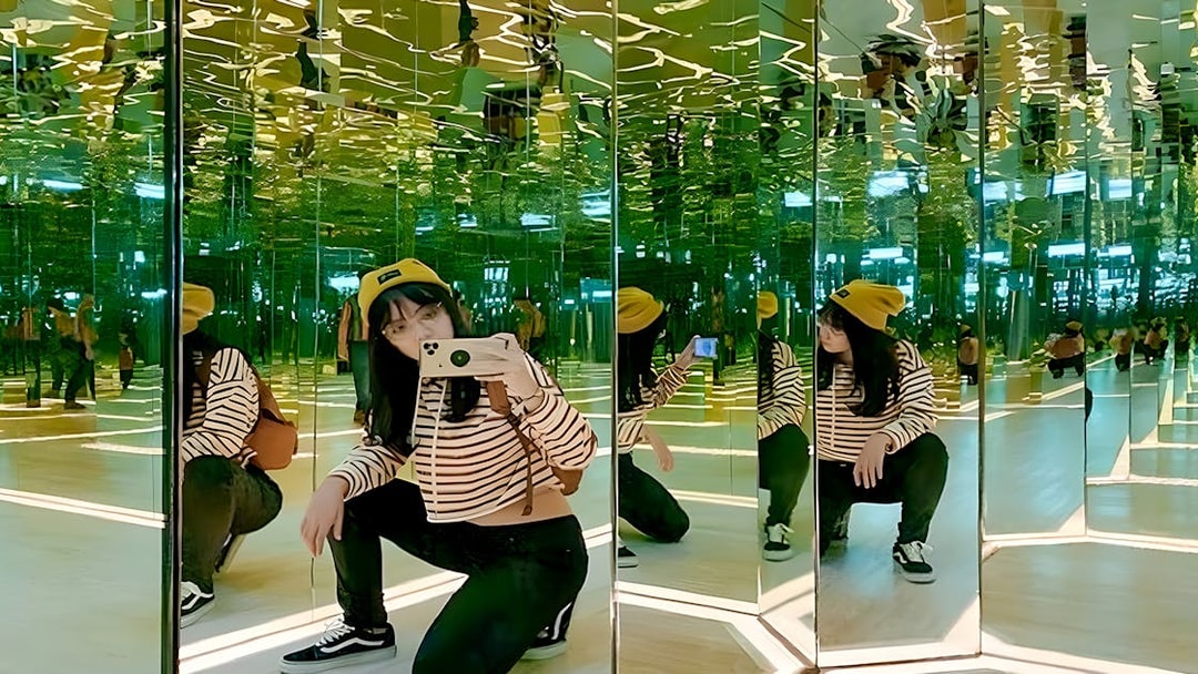 Person in a mirrored room at Ripley’s Adventureland.