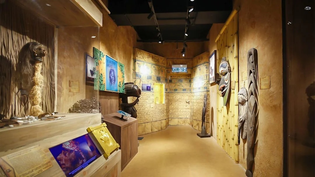 Ancient artifacts and tribal masks displayed in Ripley’s Adventureland exhibit.