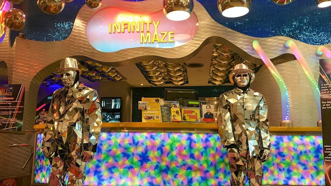 Infinity Maze entrance at Ripley's Believe It Or Not! Museum with mirrored statues.