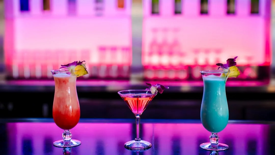 Three cocktails on a table at Rock-a-Hula show, Waikiki, Hawaii.