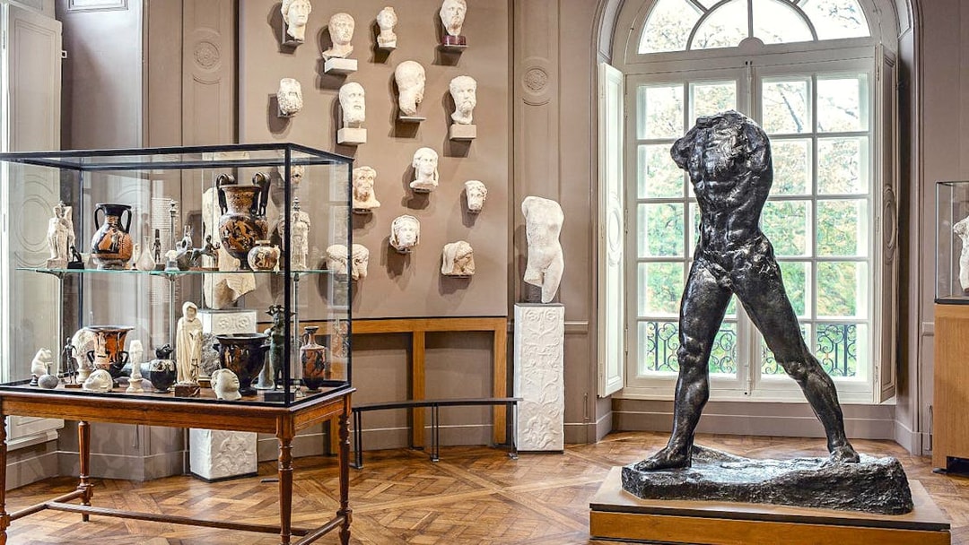 Rodin Museum interior with sculptures and artifacts display in Paris.
