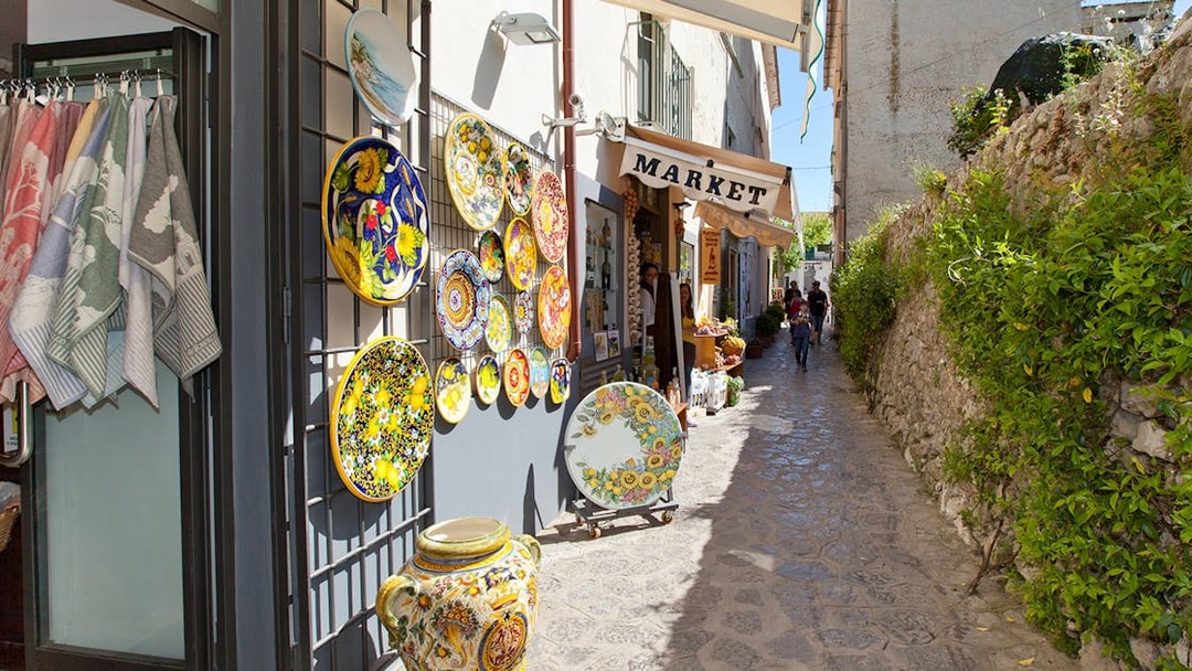 Ceramic shop and narrow street in Positano during guided tour from Sorrento.