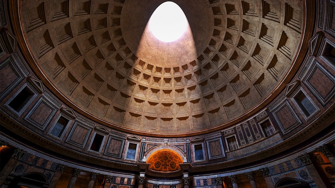 Oculus in the Pantheon dome, Rome, with sunlight streaming through.