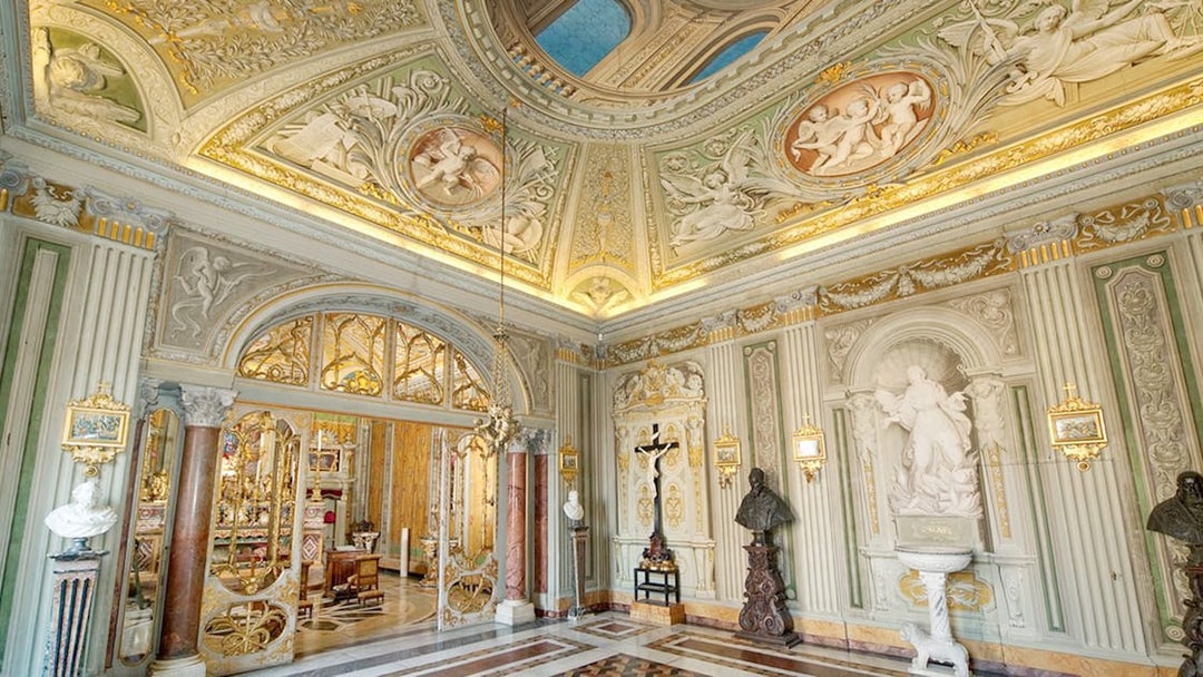 Ornate ceiling and sculptures in Doria Pamphilj Gallery, Rome.