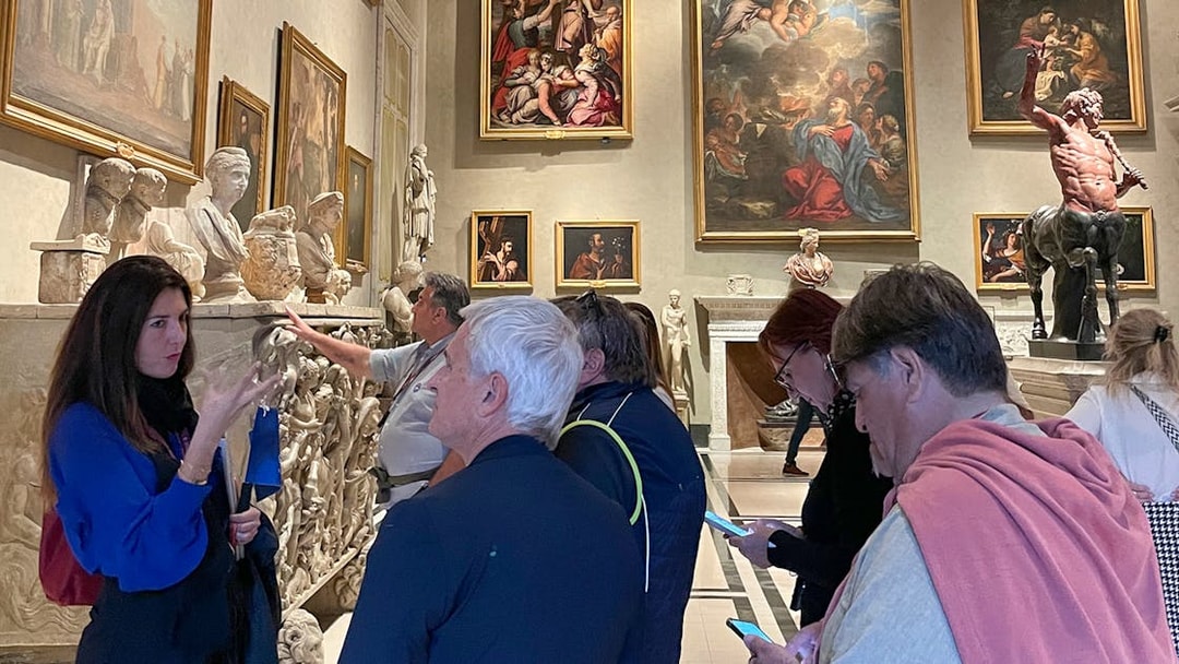 Tour group exploring art and sculptures at Doria Pamphilj Gallery in Rome.