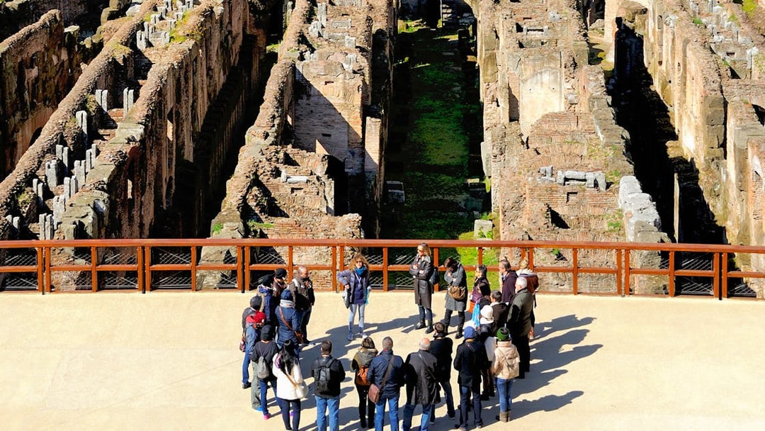 Tour group with guide at the Colosseum in Rome, part of the 'Rome in a Day' tour.