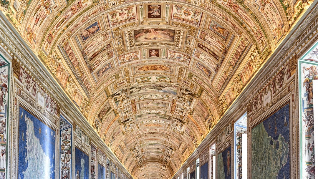 Vatican Museums' ornate ceiling and map gallery, Rome.