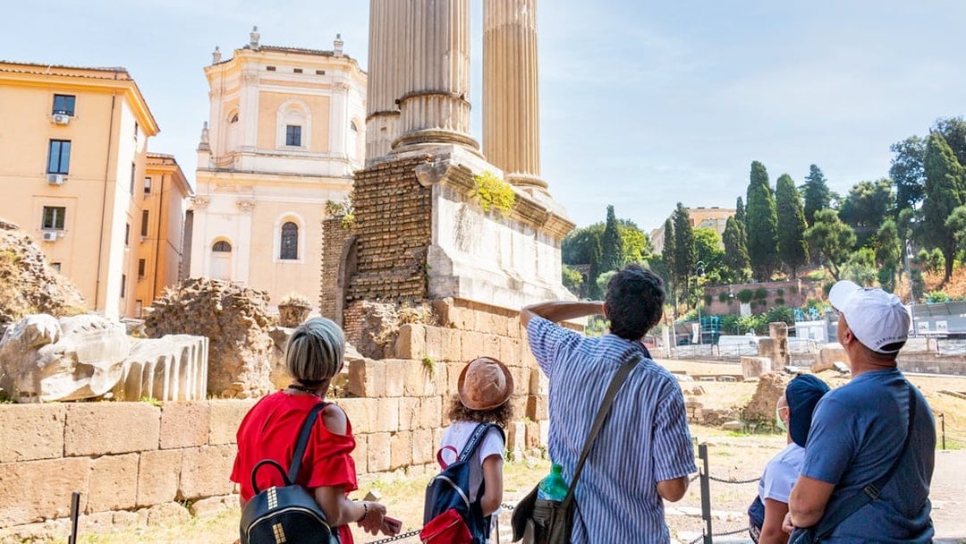 Tourists exploring ancient ruins in Rome's Jewish Ghetto.