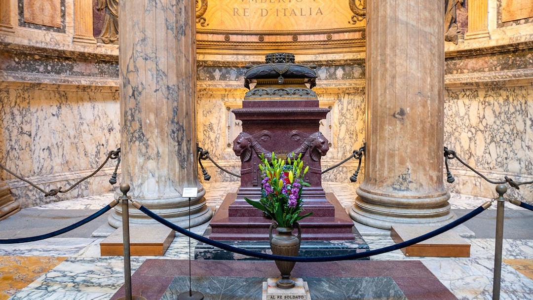Tomb of King Umberto I inside the Pantheon, Rome, with floral tribute.