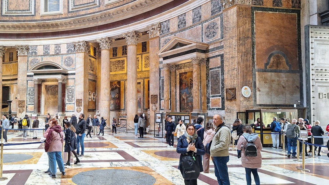 Visitors exploring the interior of the Pantheon in Rome, Italy.