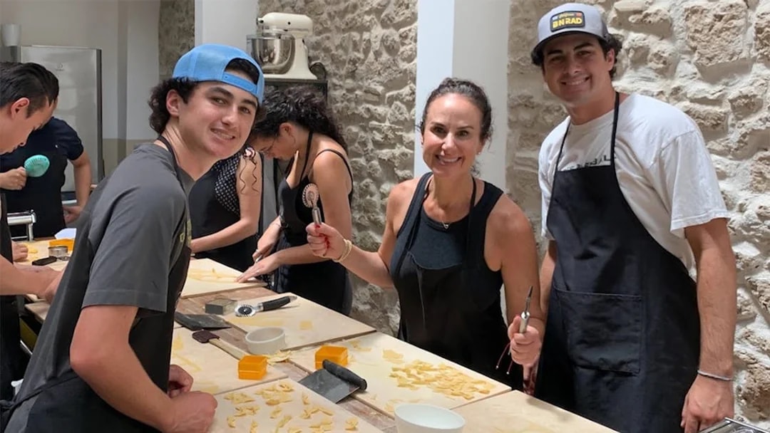 Participants making pasta in a Rome cooking class.
