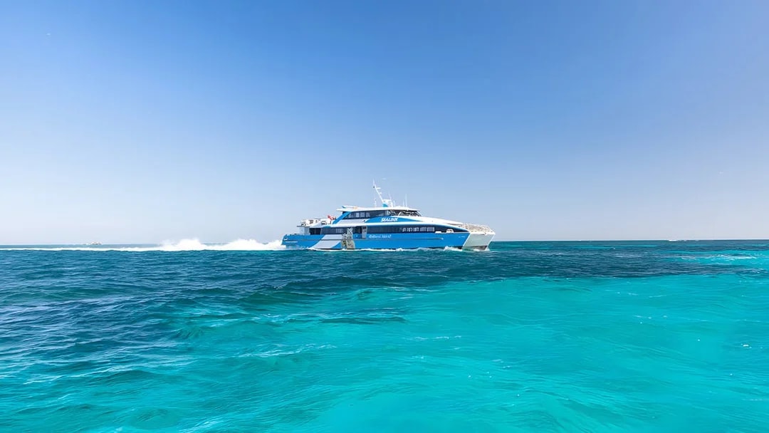 Ferry cruising on turquoise waters towards Rottnest Island from Perth.