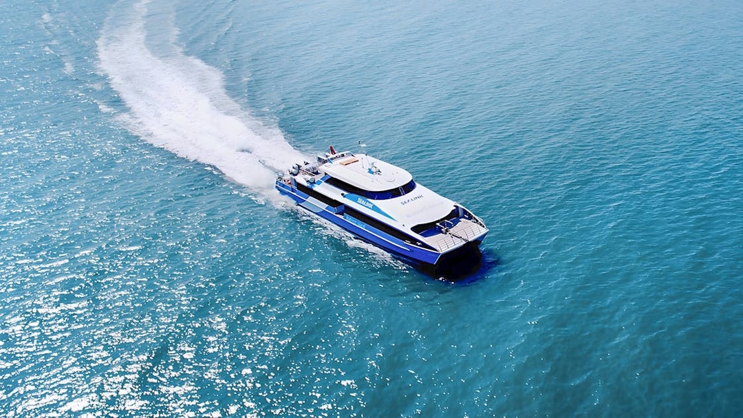 Ferry approaching Rottnest Island with ocean view, part of the guided bus tour from Perth or Fremantle.