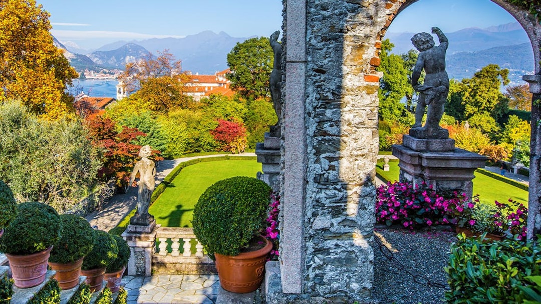 Statues and gardens at Isola Bella with Lake Maggiore in the background.