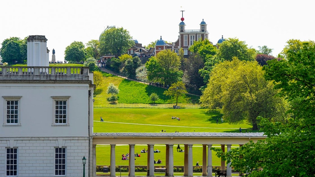 Visitors at Royal Observatory Greenwich, London, exploring the historic site and surrounding park.