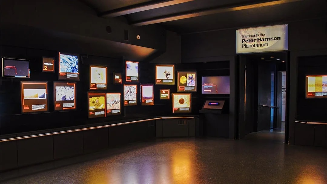Royal Observatory Planetarium Gallery with illuminated displays and entrance sign.