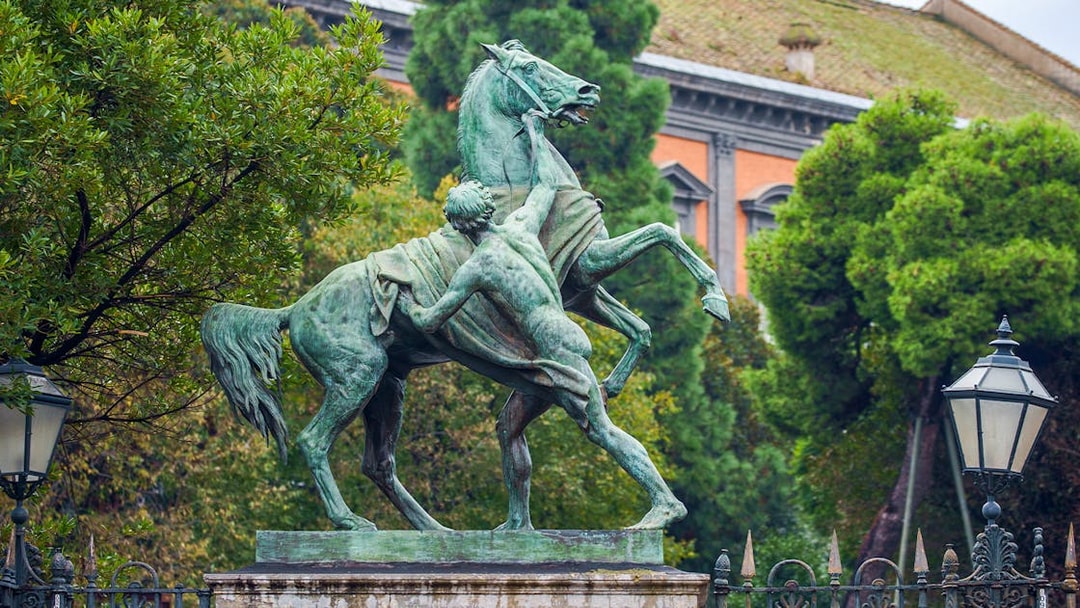 Statue of man and horse in Garden of Royal Palace, Naples.