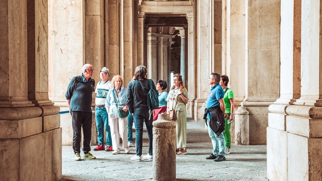 Participants on a guided tour inside the Royal Palace of Caserta, Italy.