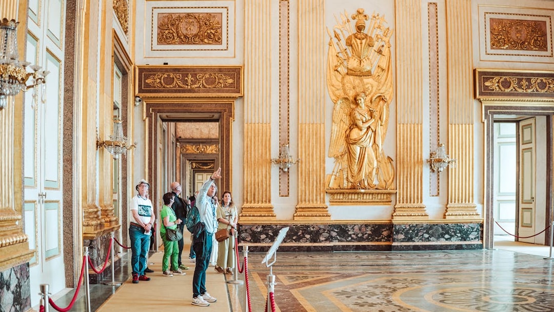 Participants on a guided tour inside the ornate Royal Palace of Caserta.