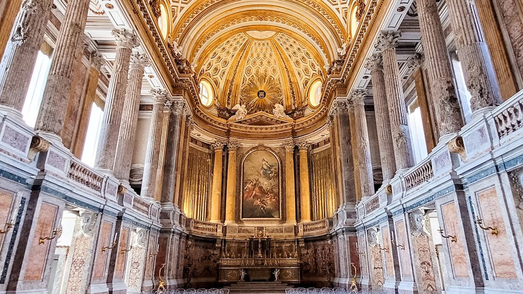 Palatine Chapel interior with ornate ceiling and columns, Royal Palace of Caserta, Italy.