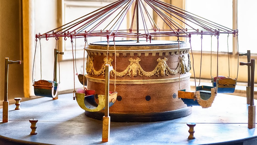 Ancient carousel model at Royal Palace of Caserta with ornate design.