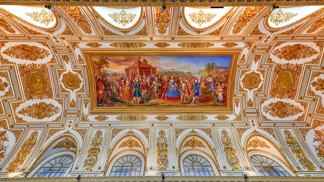 Ceiling fresco and ornate decorations at the Royal Palace of Caserta, Italy.