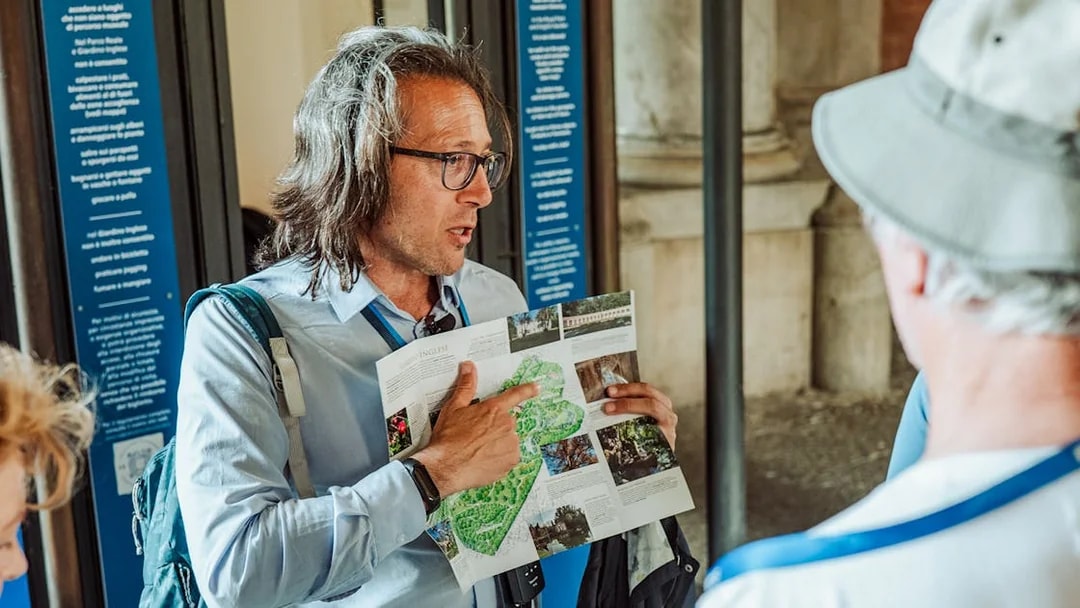 Guide explaining map during Royal Palace of Caserta small-group tour.