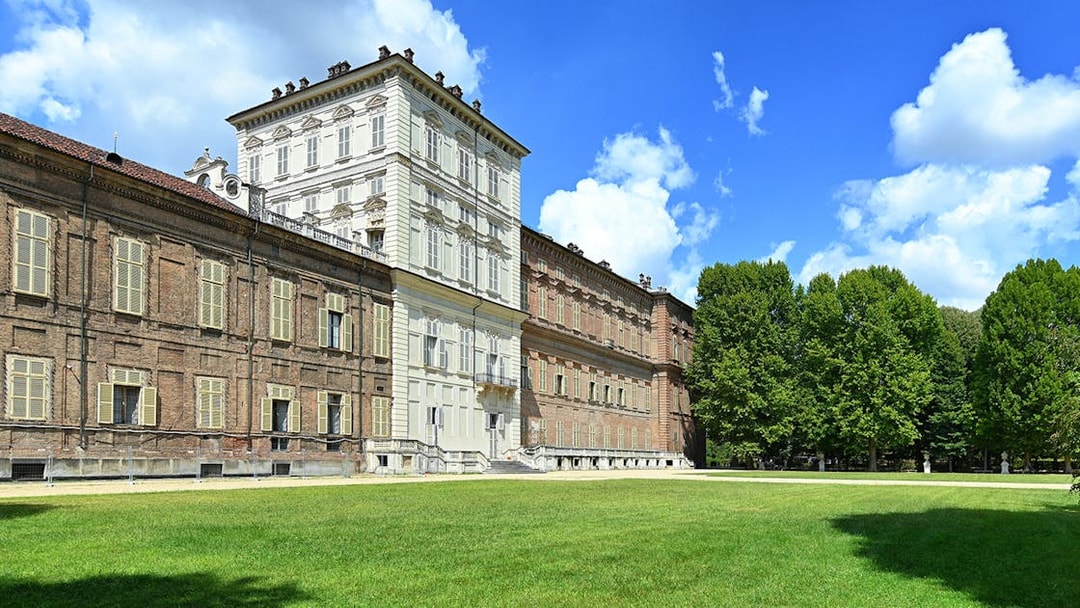 Royal Palace Museum exterior with lush gardens and clear blue sky.