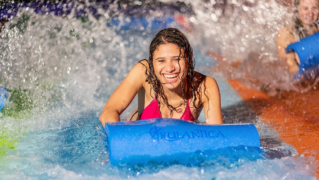 Person enjoying water slide at Rulantica water park.