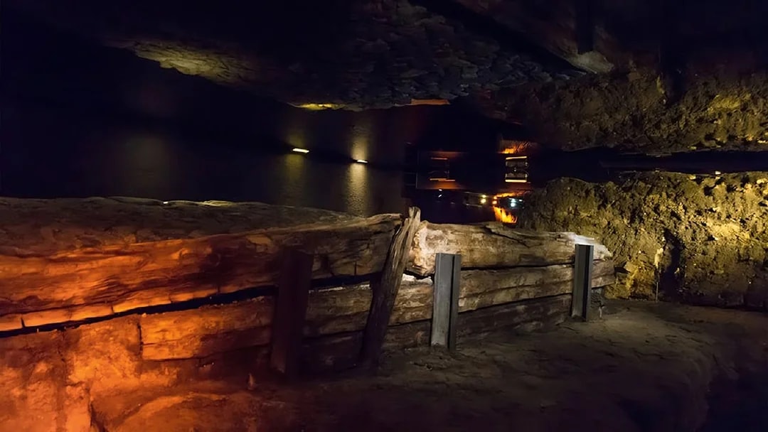 Rynek Underground Museum exhibit with ancient wooden structures in Krakow.