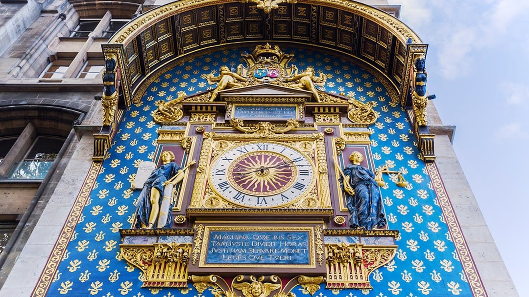 Astronomical clock on Conciergerie facade in Paris, France.