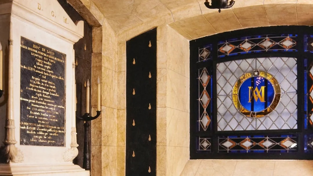 Stained glass window and stone plaque inside Conciergerie, Paris.