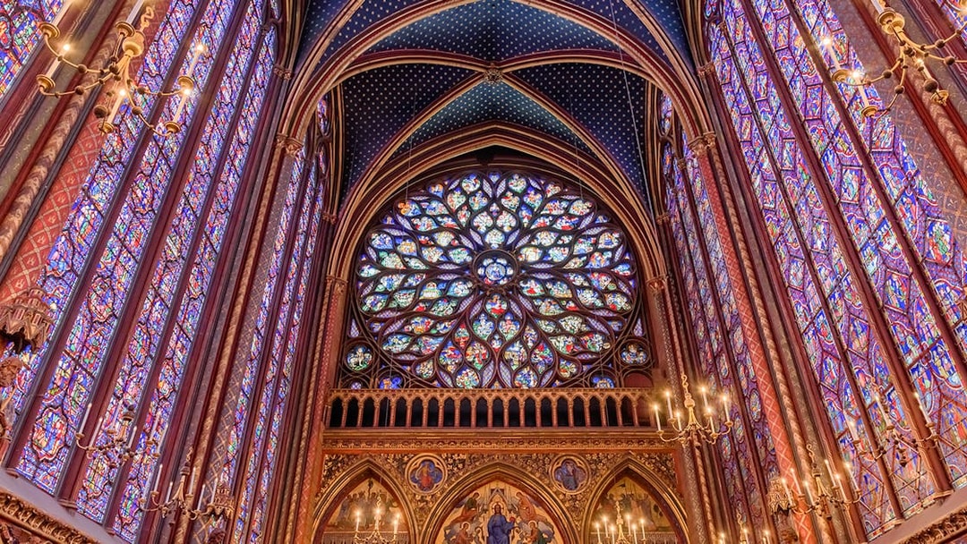 Stained glass windows and rose window inside Sainte Chapelle, Paris.