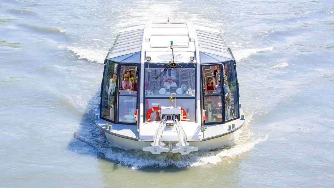 Salzburg river cruise boat with passengers on a scenic tour.