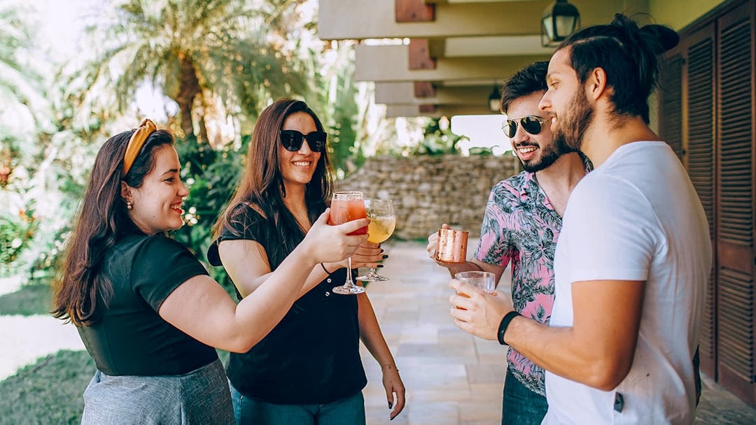 Visitors enjoying wine in Napa-Sonoma Wine Country garden.