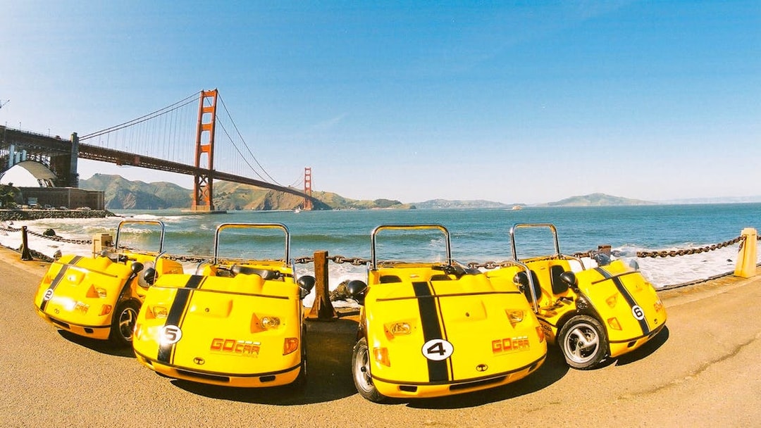Yellow GoCars parked near Golden Gate Bridge, San Francisco.