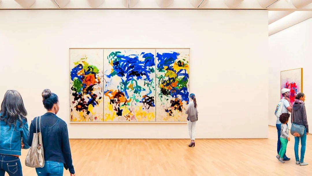 Visitors viewing abstract art at a San Francisco museum.