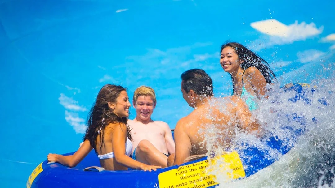 Group enjoying a water ride on a raft, part of San Francisco Explorer Pass attractions.