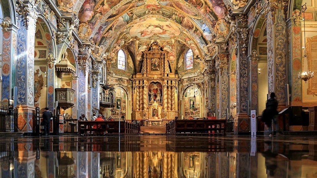 San Nicolas Church interior with ornate frescoes and gilded altar, Valencia, Spain.