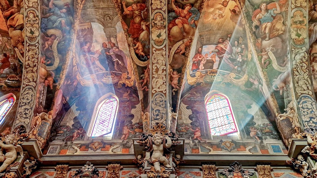 San Nicolas Church ceiling with detailed frescoes and stained glass windows in Valencia, Spain.