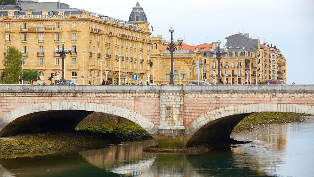 San Sebastian bridge and historic buildings on a guided walking tour.