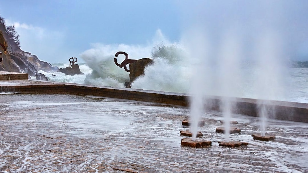 Waves crashing against the Peine del Viento sculptures in San Sebastian.