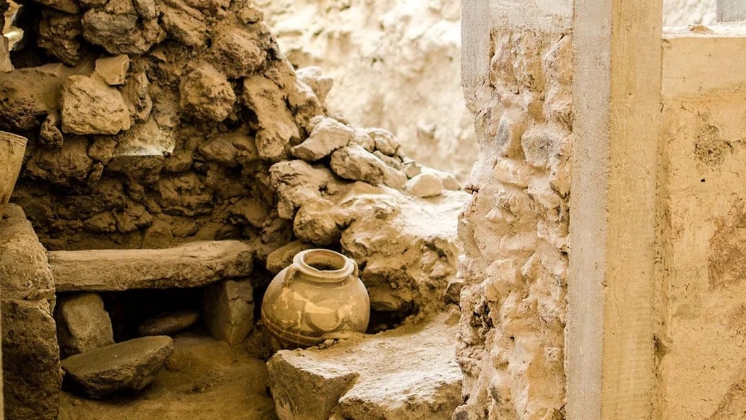 Ancient pottery and stone walls at Akrotiri Archaeological Site, Santorini.