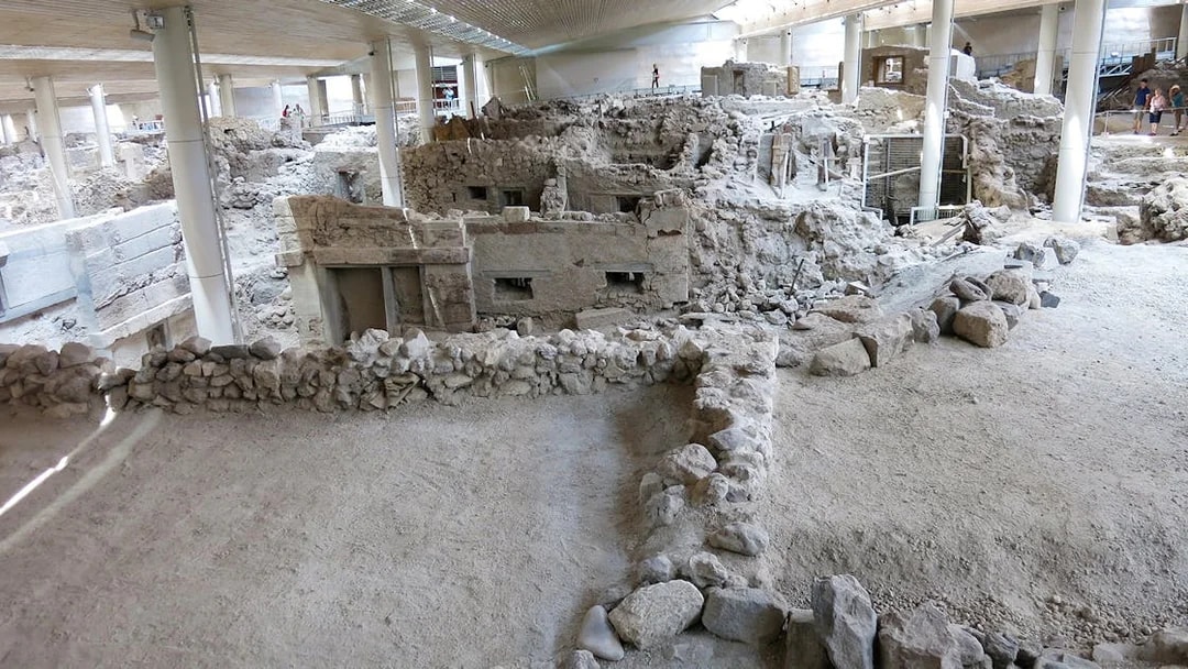 Akrotiri Archaeological Site ruins with ancient stone structures in Santorini, Greece.