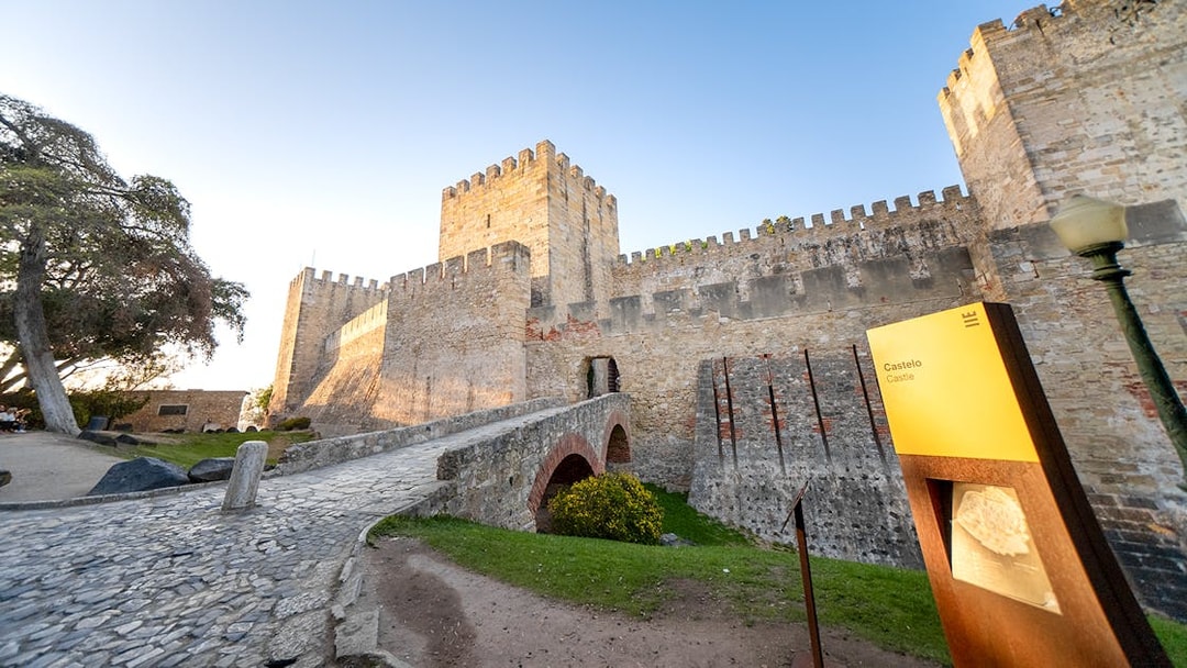 St George's Castle in Lisbon with stone walls and entrance bridge.