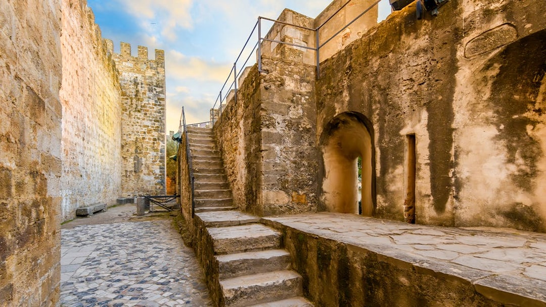 Stone pathway and stairs inside Sao Jorge Castle, Alfama district, Lisbon, Portugal.