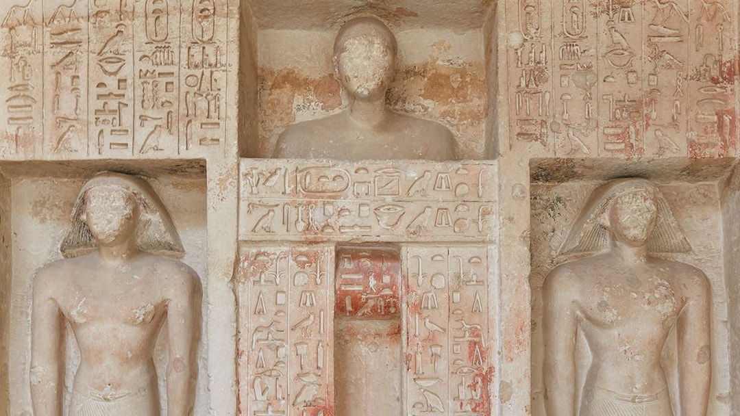 Ornate carvings and hieroglyphs from an Old Kingdom tomb in Saqqara, Egypt.