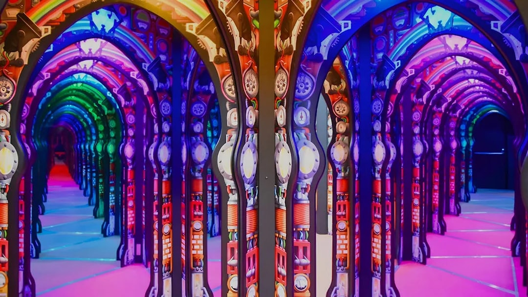 Colorful mirrored arches at Science Centre Singapore exhibit.